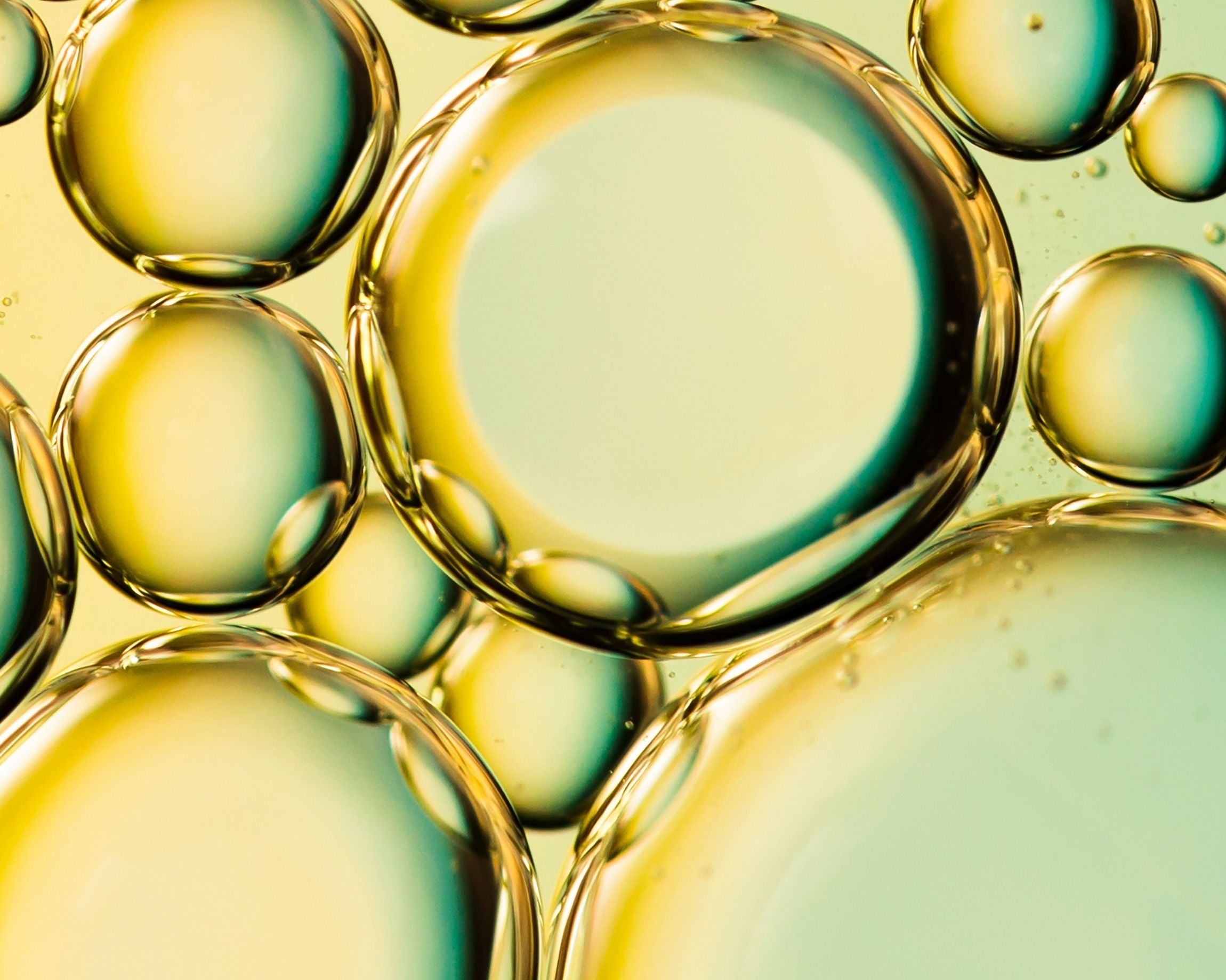 Close-up of oil bubbles on a liquid surface