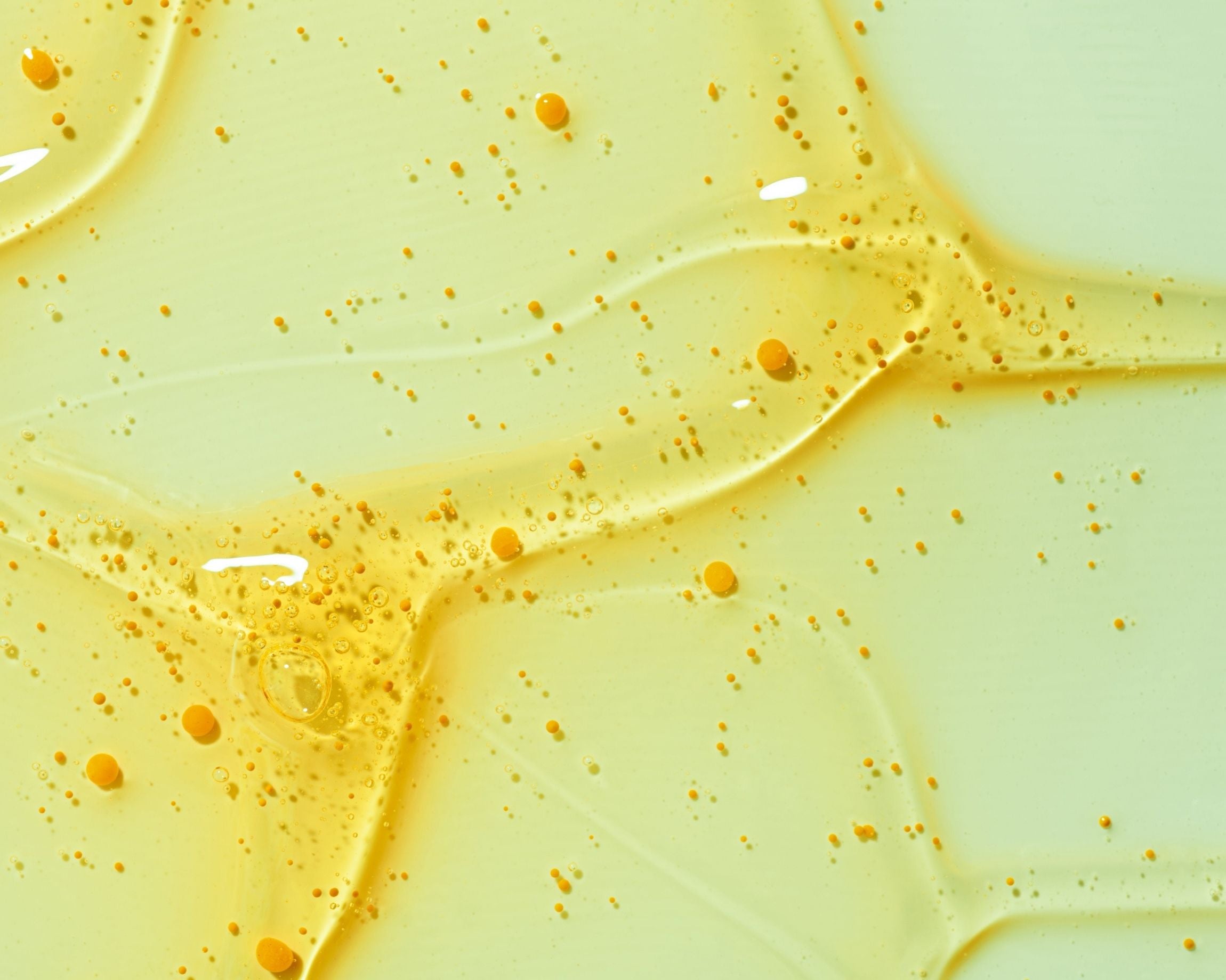 Close-up of a yellow and green liquid with bubbles
